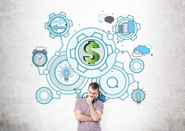 A man thinking in front of a drawing of money and planning icons